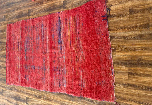 5x9 ft vintage red Moroccan rug.
