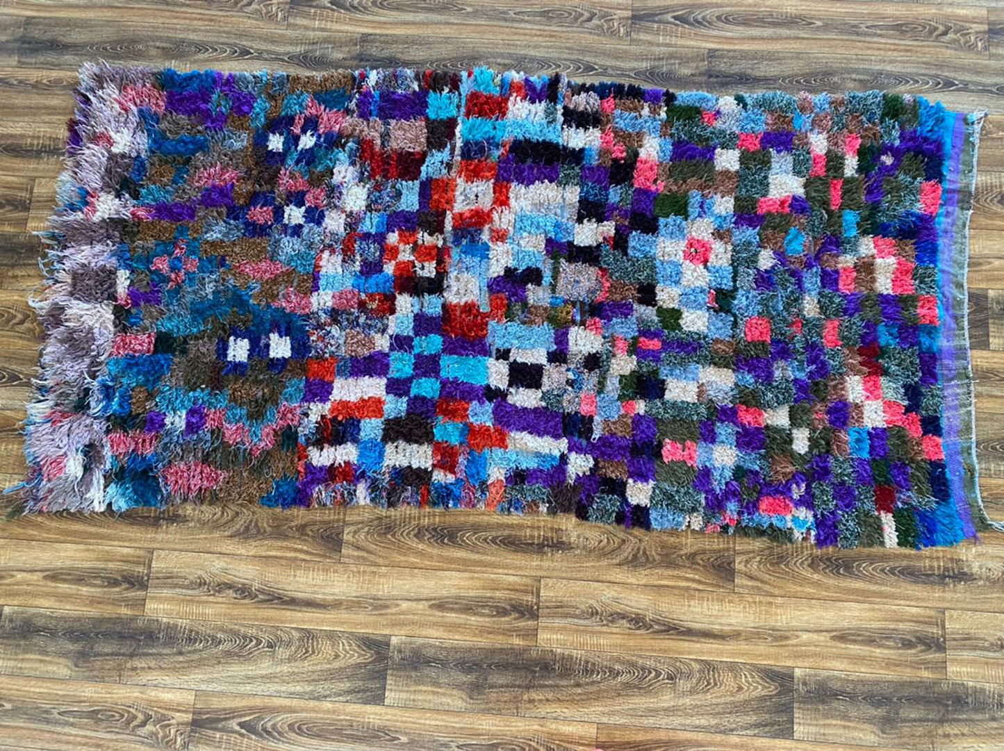 4x8 ft Moroccan woven area rug.