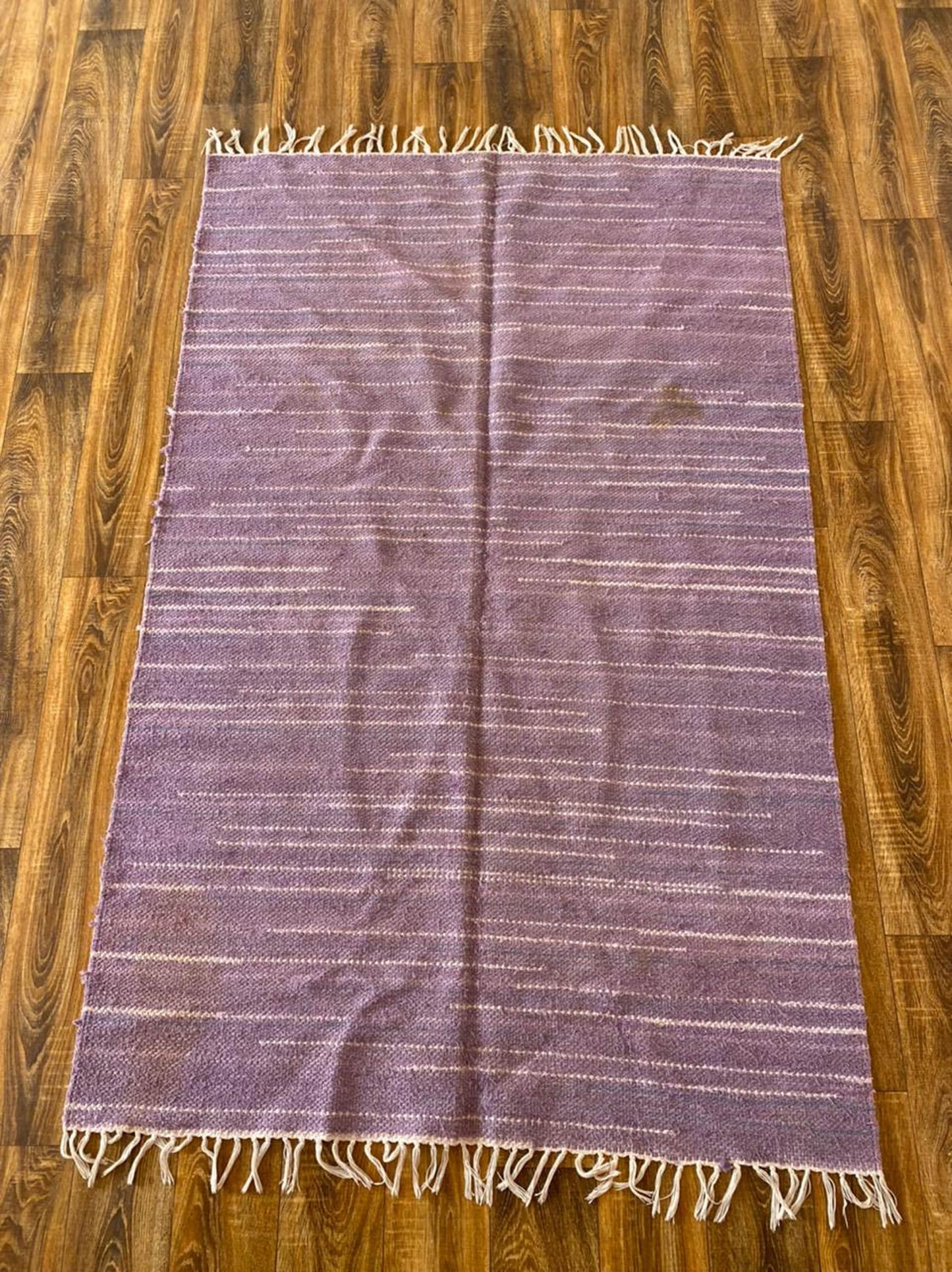 4x7 ft Moroccan purple Berber rug.