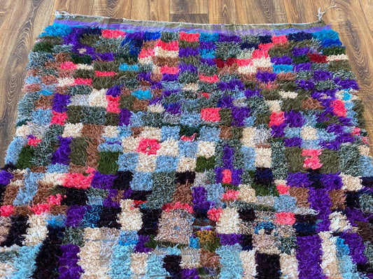 4x8 ft Moroccan woven area rug.