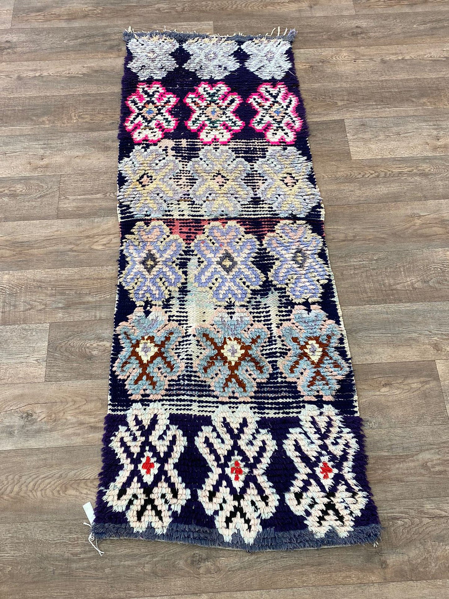 Berber Moroccan faded 2x7 runner rug.