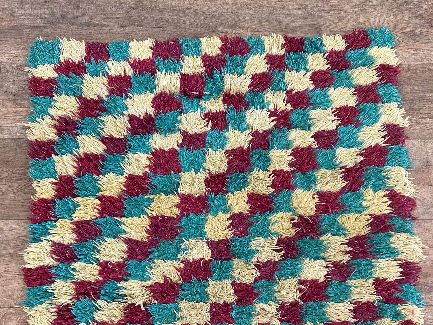 Narrow entryway checkered 3x7 runner rug.