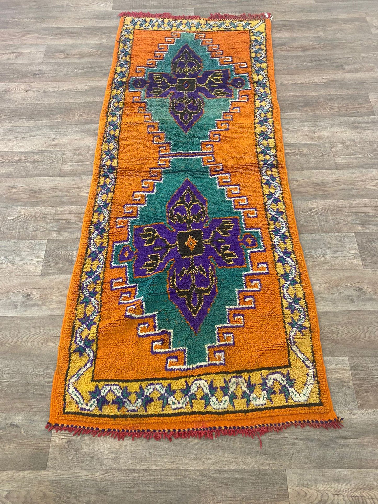 Long colorful Moroccan 4x9 runner rug.