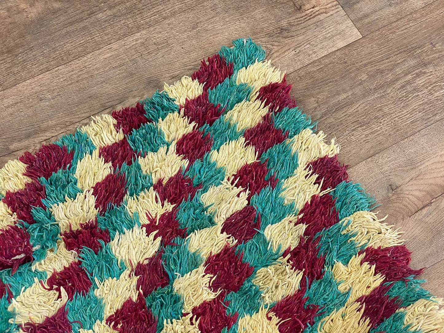 Narrow entryway checkered 3x7 runner rug.