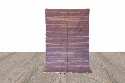 4x7 ft Moroccan purple Berber rug.