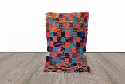 3x6 ft vintage Boucherouite Moroccan rug.