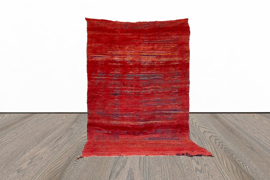 5x9 ft vintage red Moroccan rug.