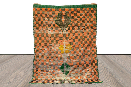 4x6 Moroccan checkered orange and black worn area Rug.