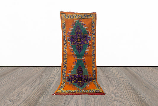 Long colorful Moroccan 4x9 runner rug.