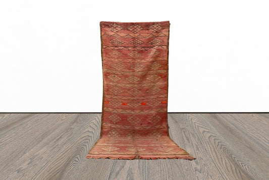 Narrow flat weave tribal 4x10 runner rug.