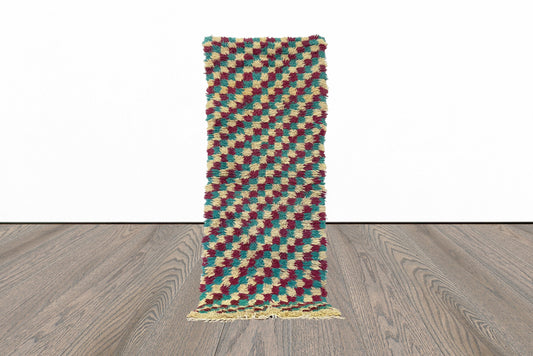 Narrow entryway checkered 3x7 runner rug.
