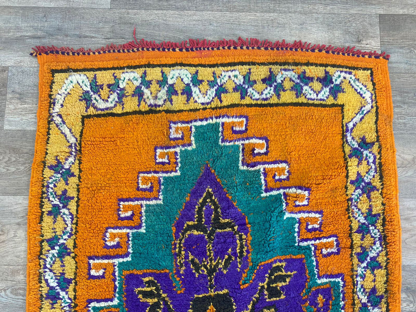 Long colorful Moroccan 4x9 runner rug.