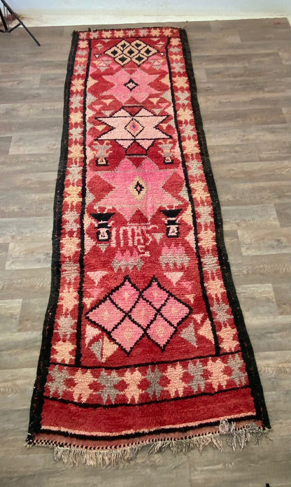 Narrow Moroccan vintage 4x12 runner rug.